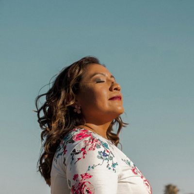 Close-up of a person breathing deeply with eyes closed.